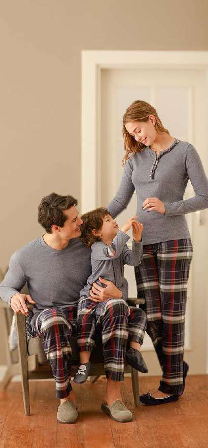 Mother, father and child in grey plaid pyjamas